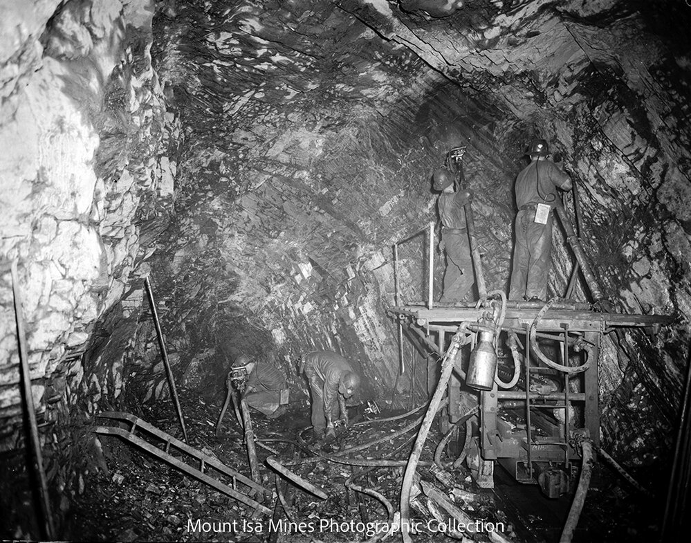 Four miners drilling at the face, Mount Isa Mines, March 1962