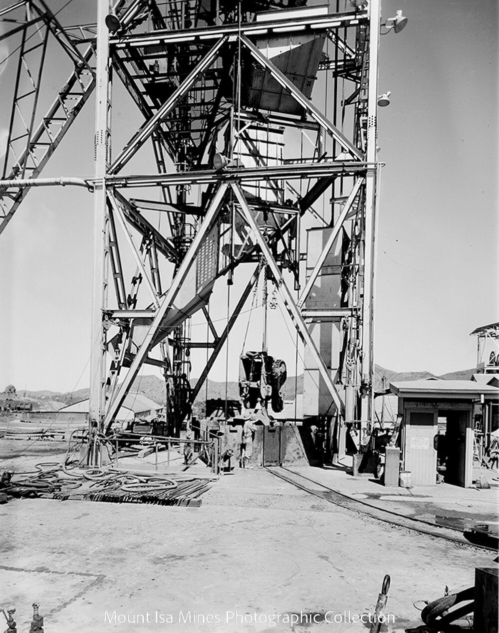 Eimco loader being lowered into K57 Shaft Sink, Mount Isa Mines, August 1962