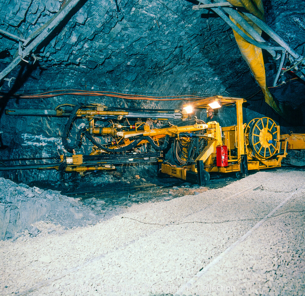 Rail mounted jumbo drill, Hilton Mine, April 1987