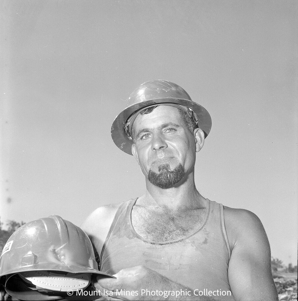 Miner showing damage on his hard hat, September 1969