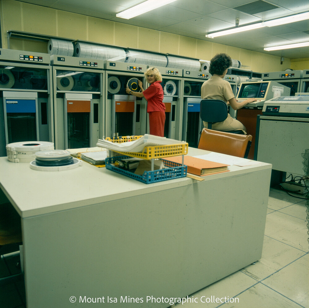 Changing a digital magnetic tape drive in computer room, Mount Isa Mines, January 1987
