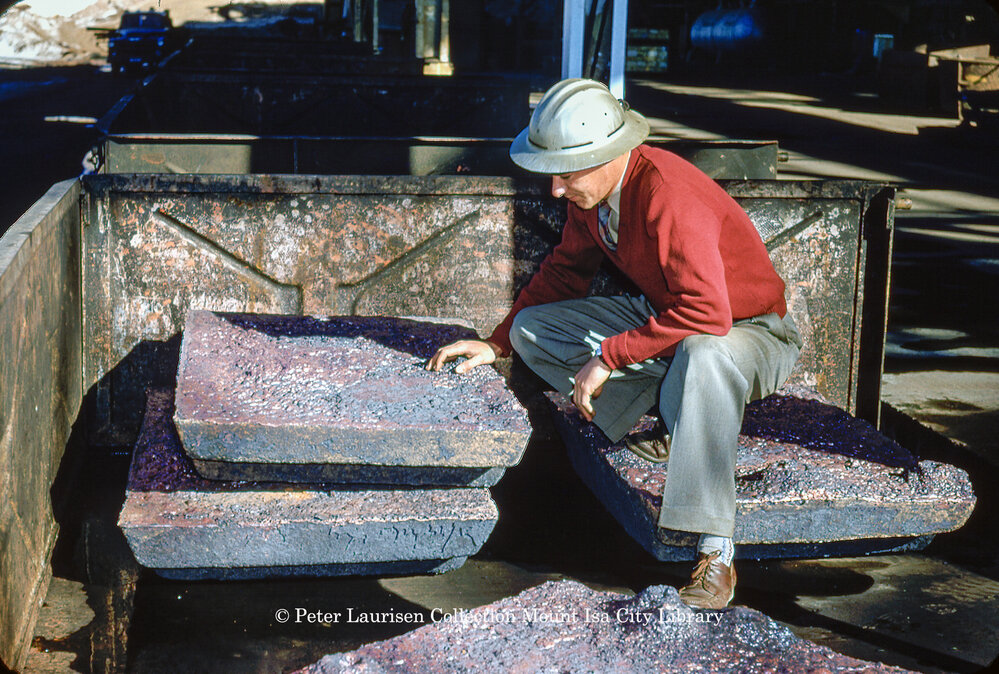 Inspecting blister copper at Copper Smelter, Mount Isa Mines, c.1956