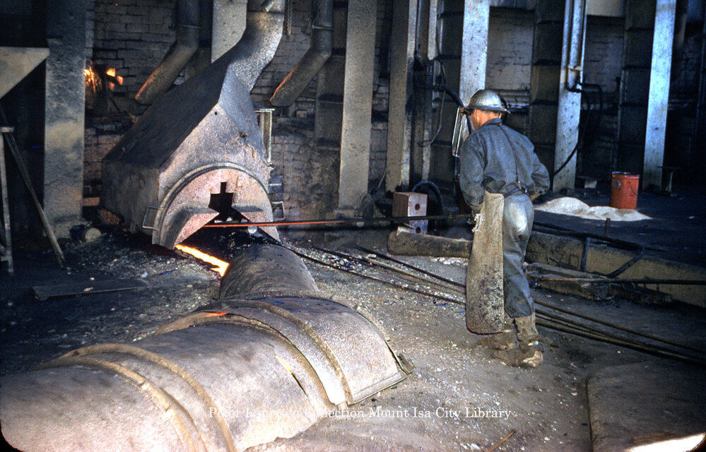Tapping matte reverberatory furnace at Copper Smelter, Mount Isa Mines, c.1956