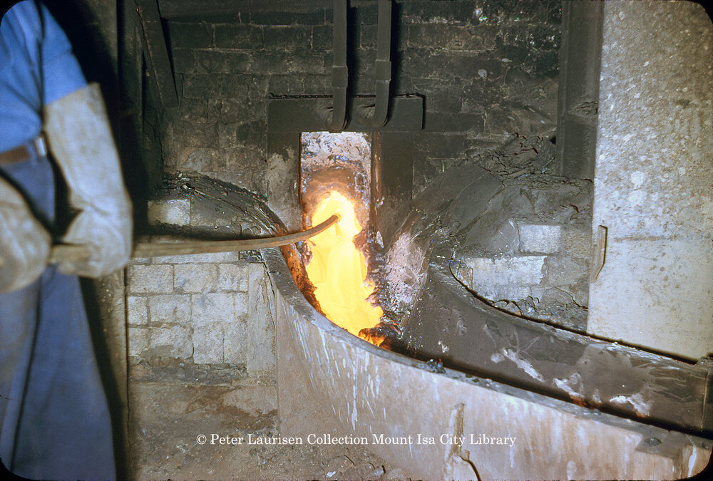 Tapping matte reverberatory furnace at Copper Smelter, Mount Isa Mines, July 1956