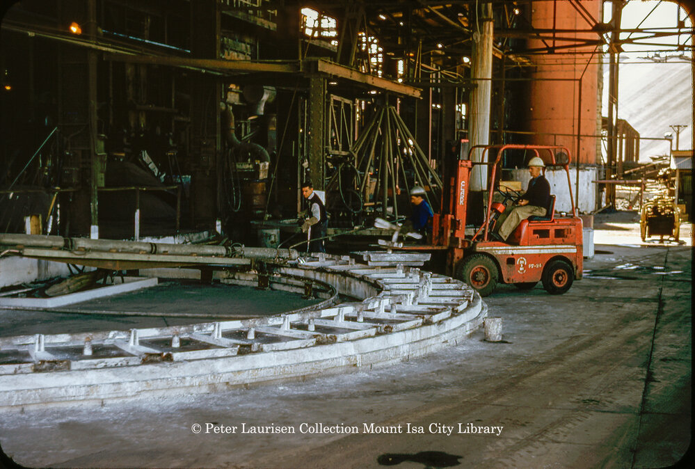 Casting wheel for lead blocks at Lead Smelter, Mount Isa Mines, July 1956