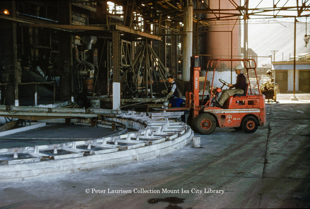 Casting wheel for lead blocks at Lead Smelter, Mount Isa Mines, July 1956