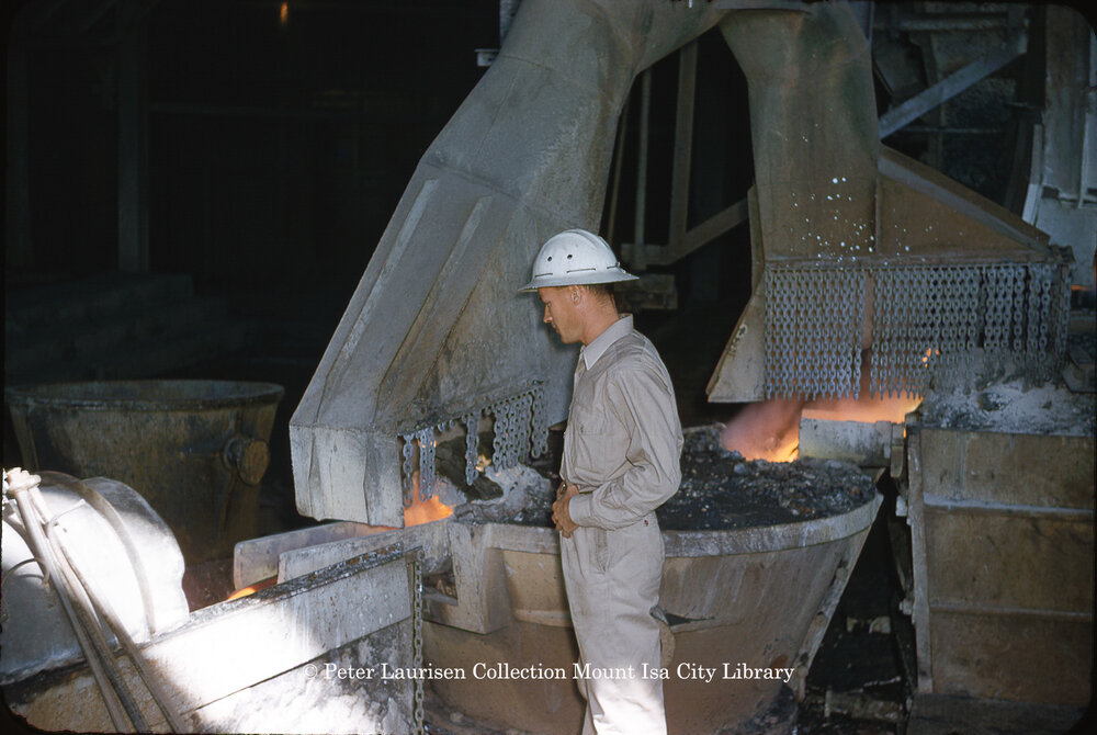 Separating slag from molten lead from the furnace at Lead Smelter, Mount Isa Mines, July 1956
