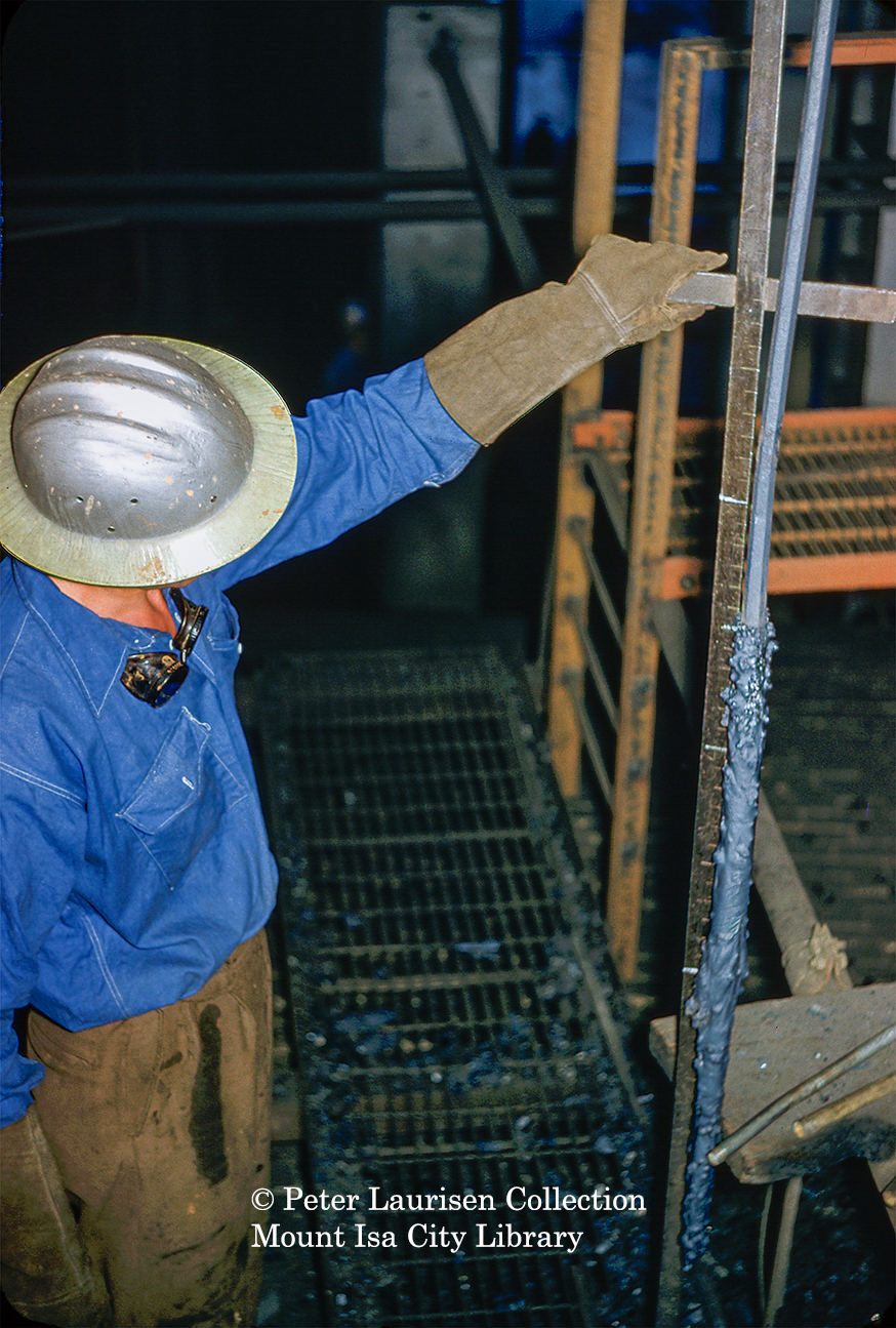 Worker checking thickeners level at Mill, Mount Isa Mines, July 1956