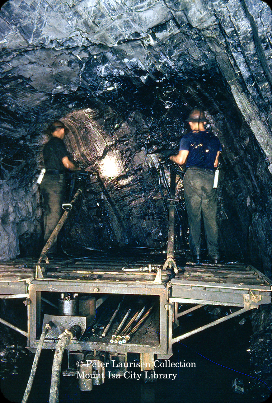 Underground rail mounted air leg drilling platform, Mount Isa Mines, c.1956