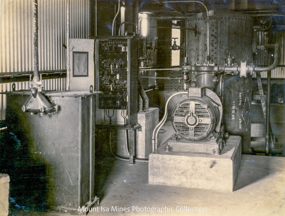 Urquhart Hoist House basement showing air compressor and receiver, Mount Isa Mines, January 1931