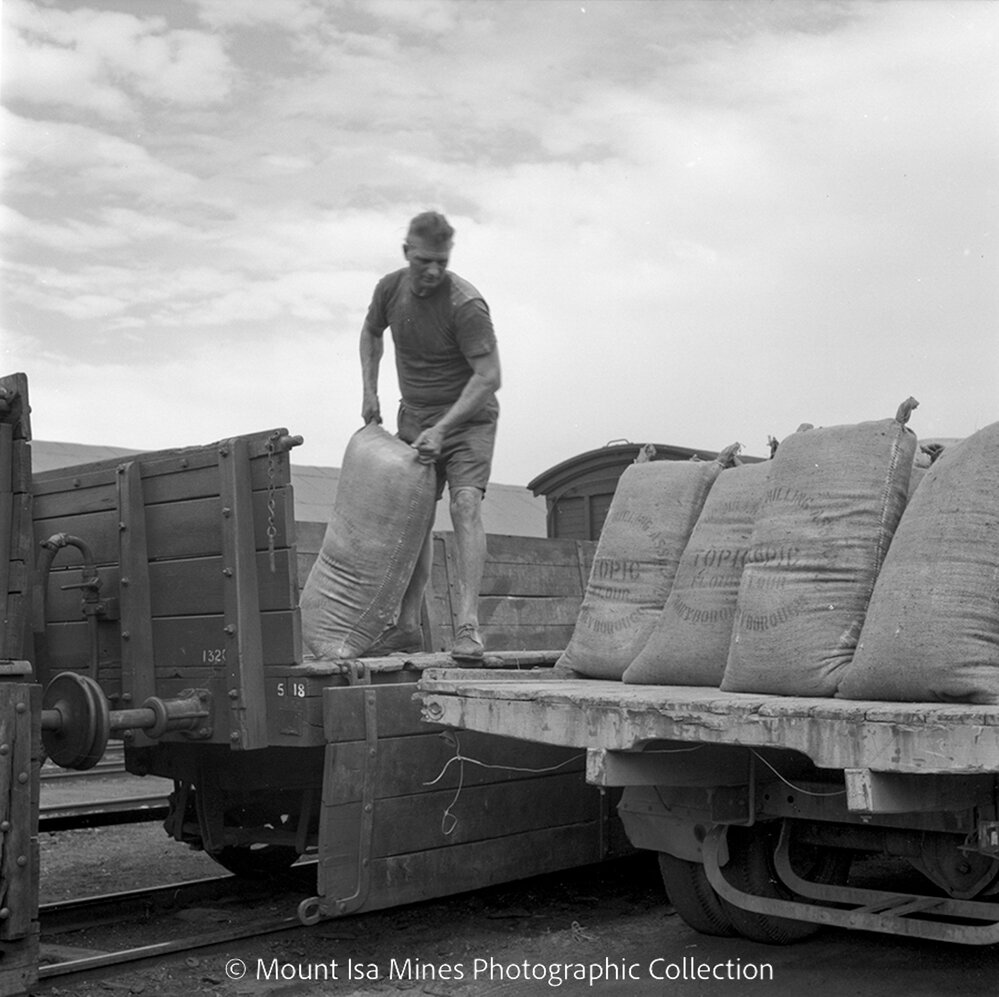 Baker unloading flour at Railway Station, Townside, June 1958