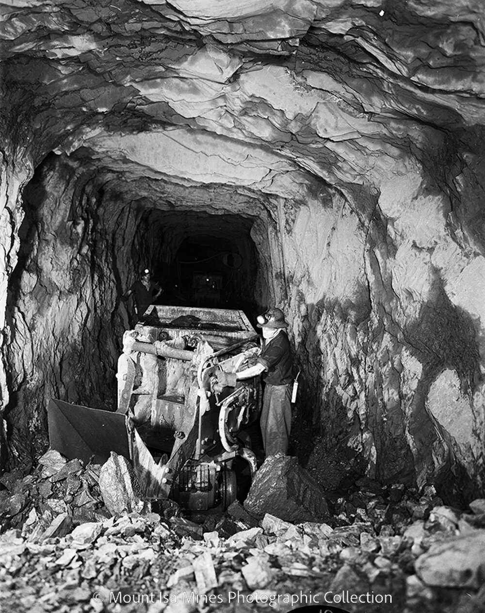 Rail mounted rocker shovel at lead mine, Mount Isa Mines, June 1958