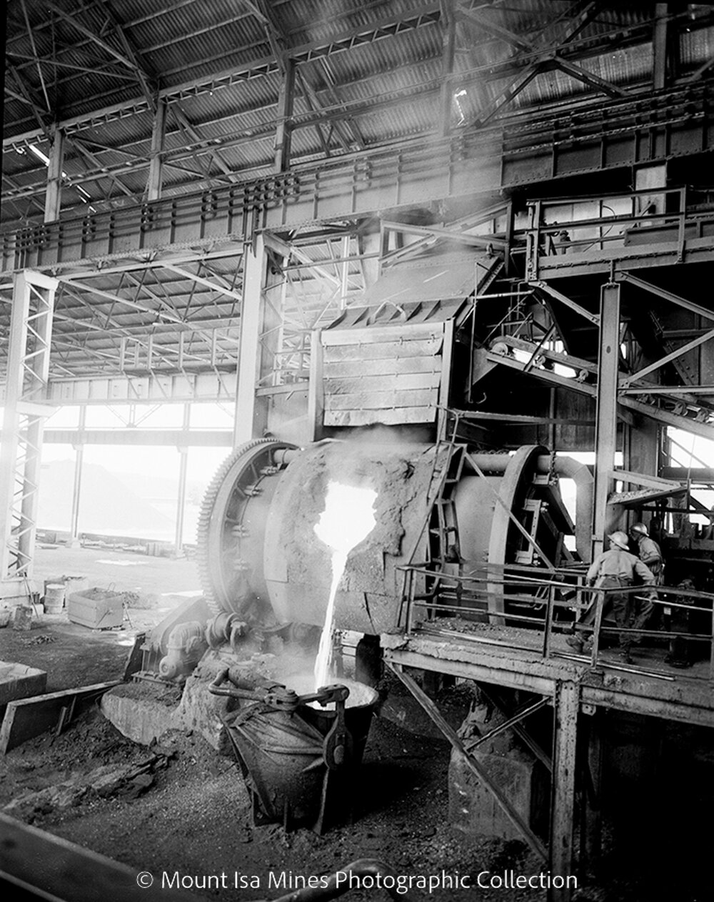 Pouring molten copper into crane ladle from the converter at Copper Smelter, October 1958