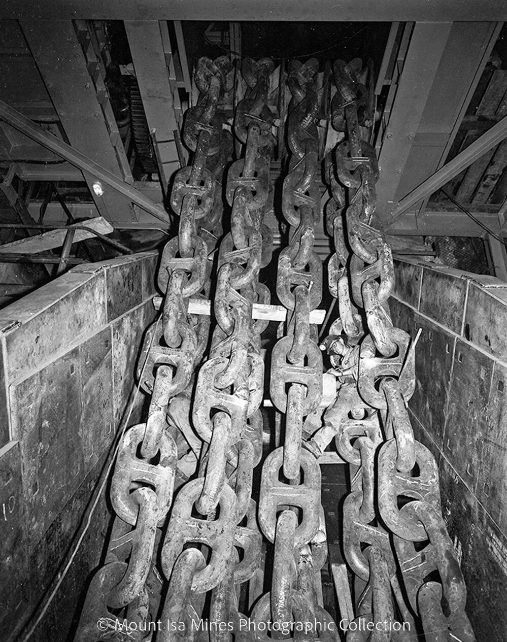 Feed control chains completed, Primary Crusher 14 Level, Mount Isa Mines, April 1959
