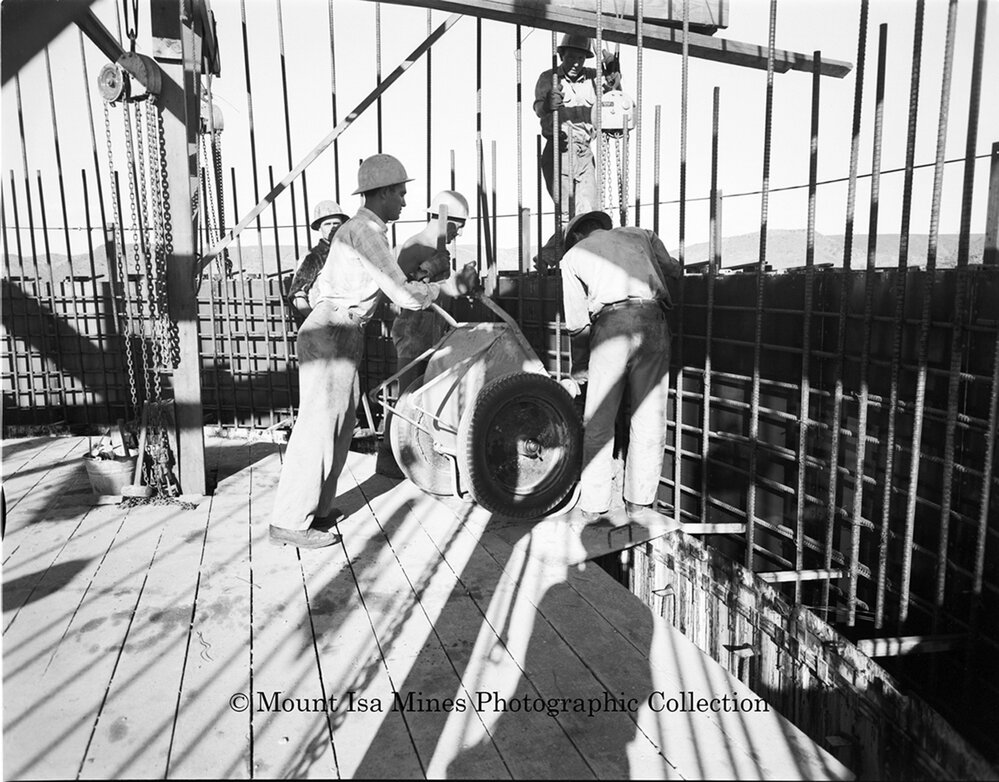 Pouring concrete at new Copper Stack, Mount Isa Mines, September 1959