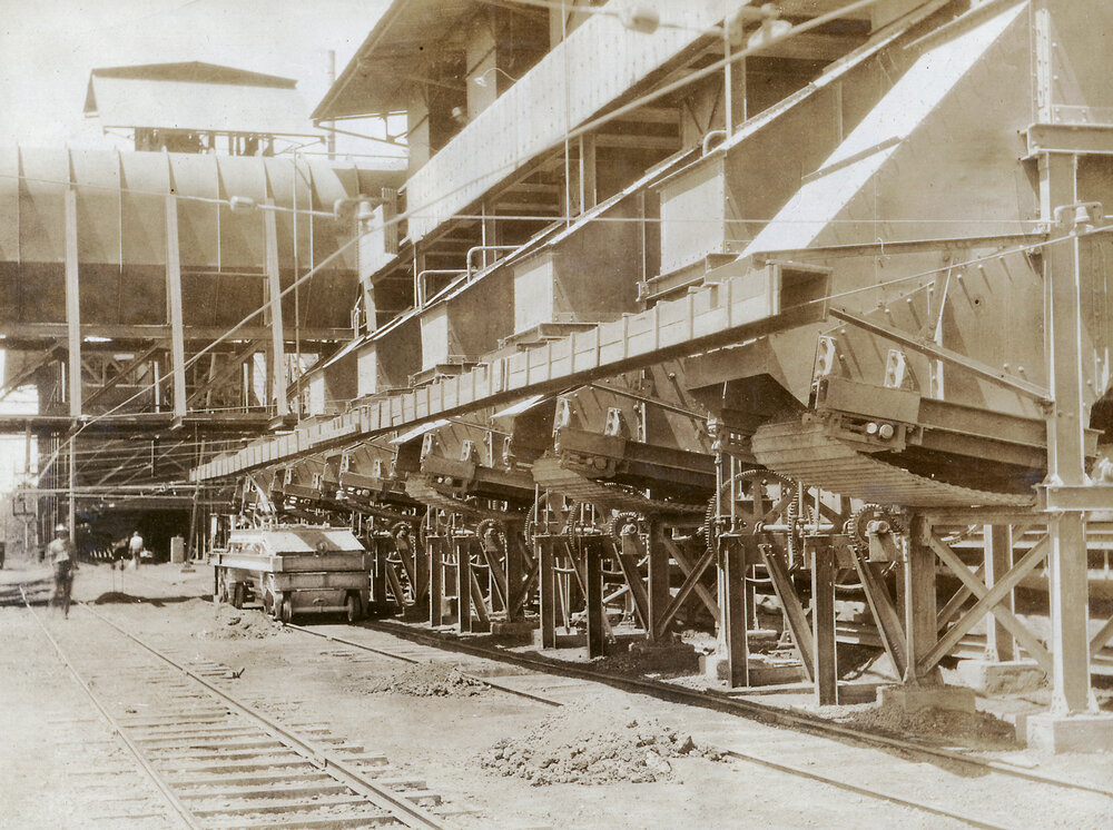Discharge end of sinter plant to charge car, Mount Isa Mines, c.1932