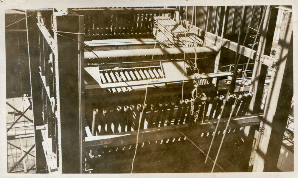 Inserting boiler tubes at Mines Power Station Expansion, Mount isa Mines, c.1936
