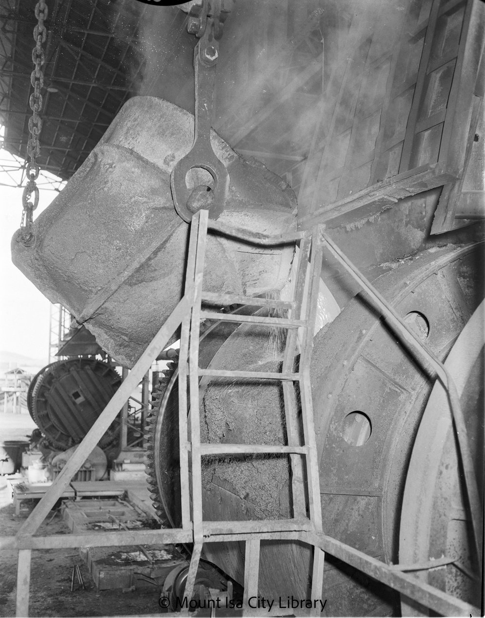 Charging converter with matte at Copper Smelter, Mount Isa Mines, c.1956
