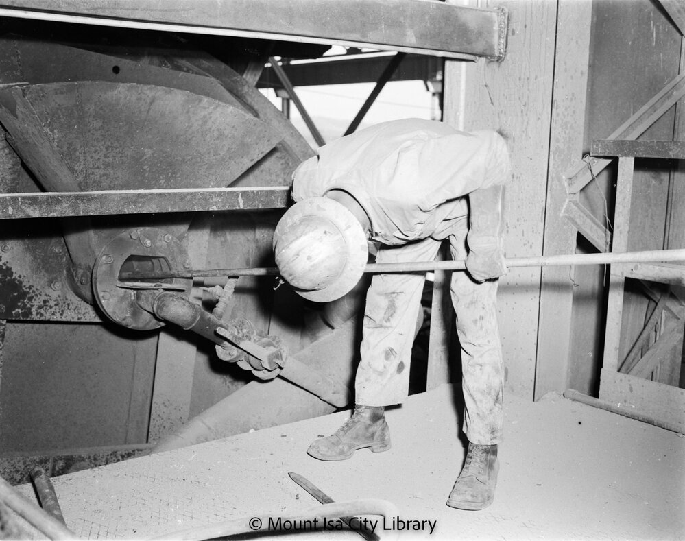 Inspecting disk filter Copper Smelter, Mount Isa Mines, c.1956