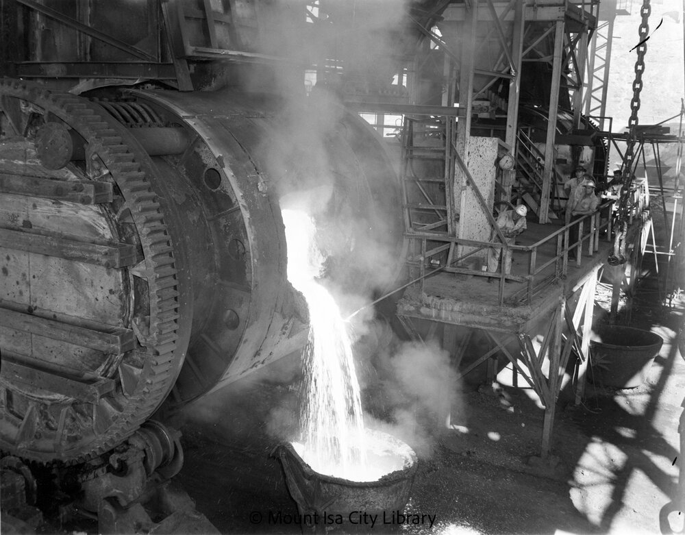 Pouring molten copper from converter at Copper Smelter, Mount Isa Mines, c.1956
