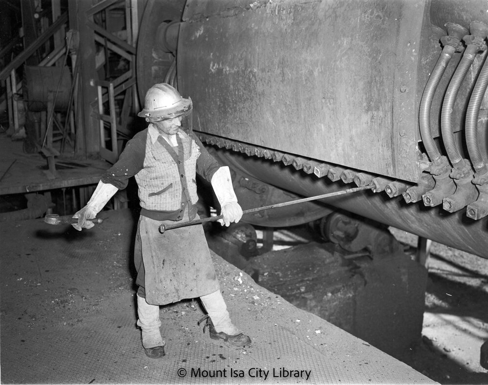 Punching tuyeres in converter at Copper Smelter, Mount Isa Mines, c.1956