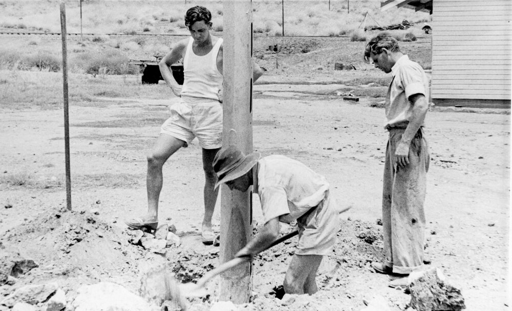 Electrical construction crew erecting a power pole, Mineside, c.1950