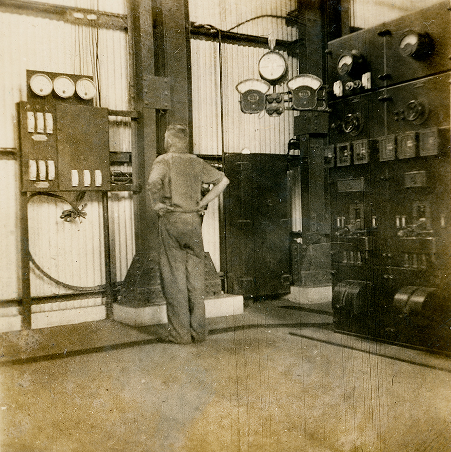 Electrician at Diesel Generator Board, Man and Supply 