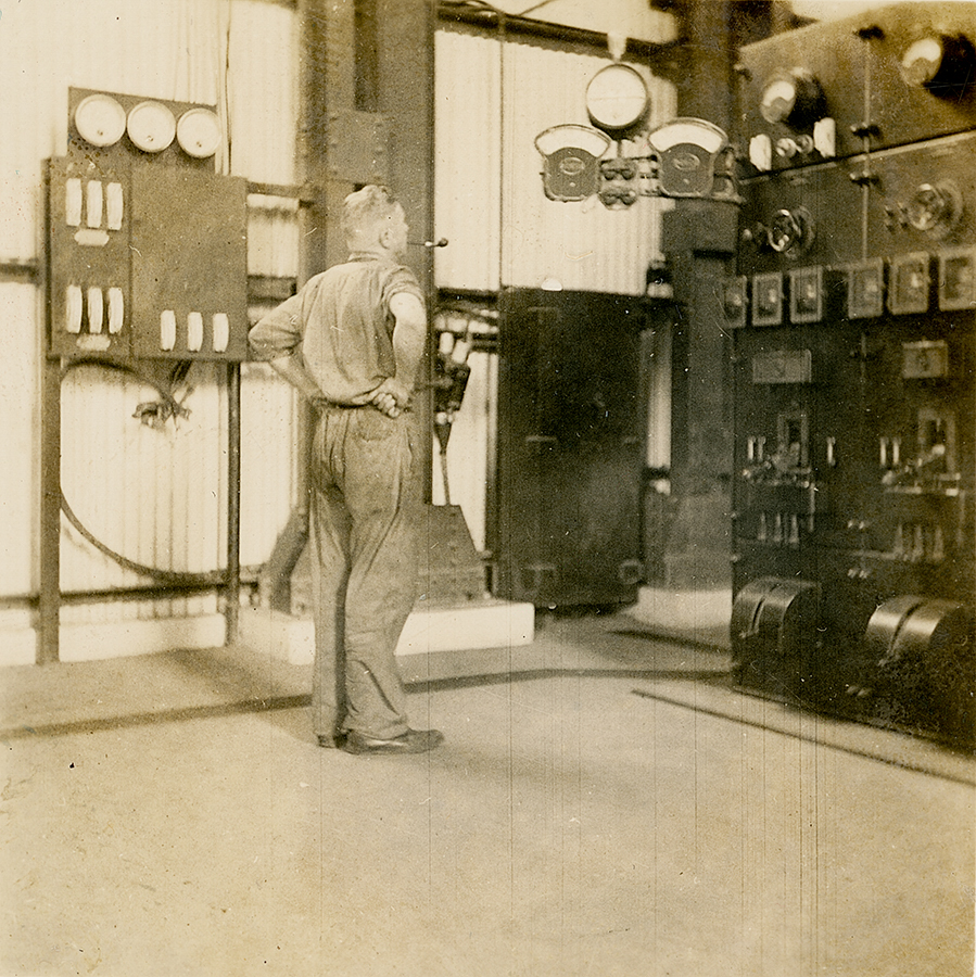 Electrician at Diesel Generator Board, Man and Supply 