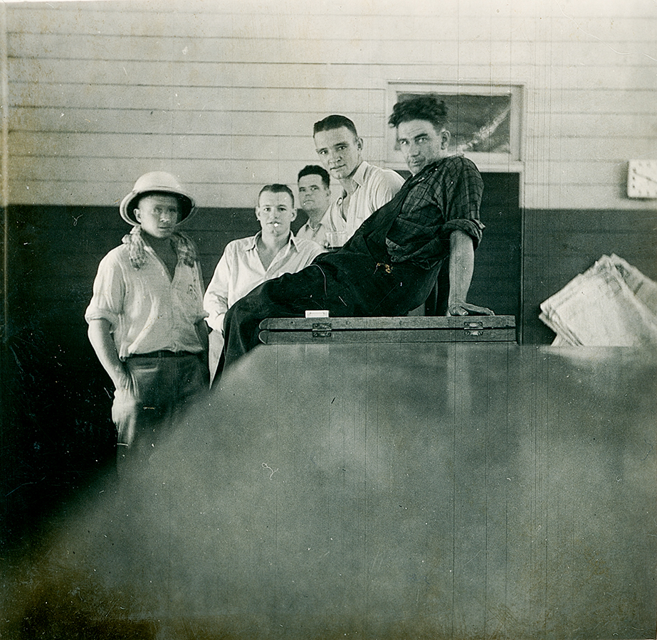 Group of men having a beer in hotel 