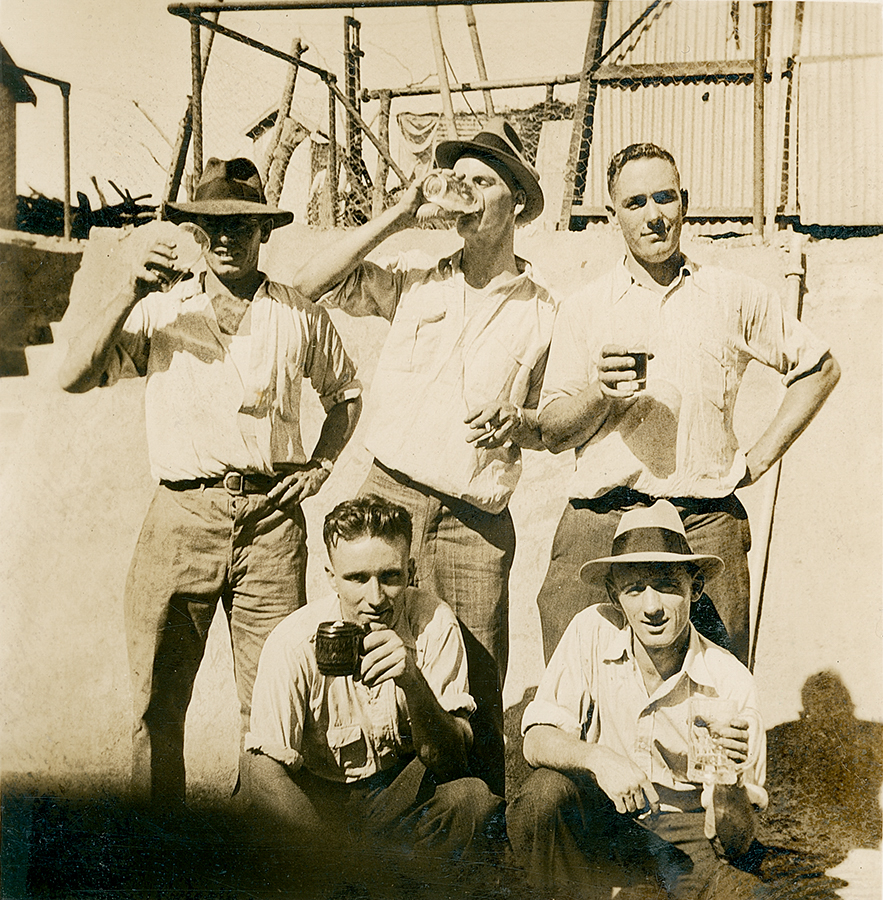 Group of men having beer at The Isa Hotel