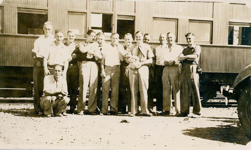 Group of men at railway station Mount Isa 