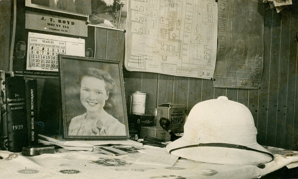 Photographer and electrician inside barracks room, March 1939