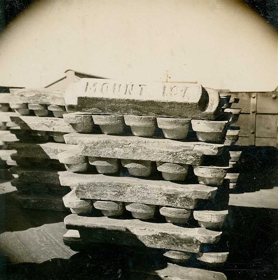 Stacked lead ingots ready to be loaded into railway wagon, Lead Smelter