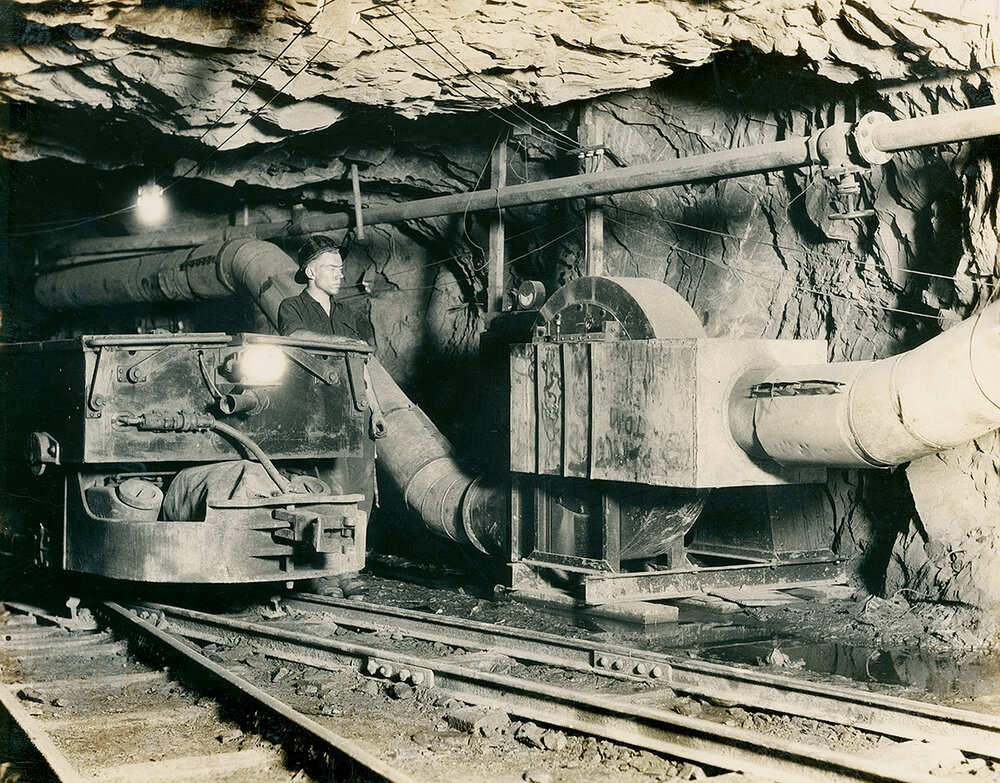 Ventilation fan and Mancha battery powered locomotive on 5 Level Rio Grande, Mount Isa Mines
