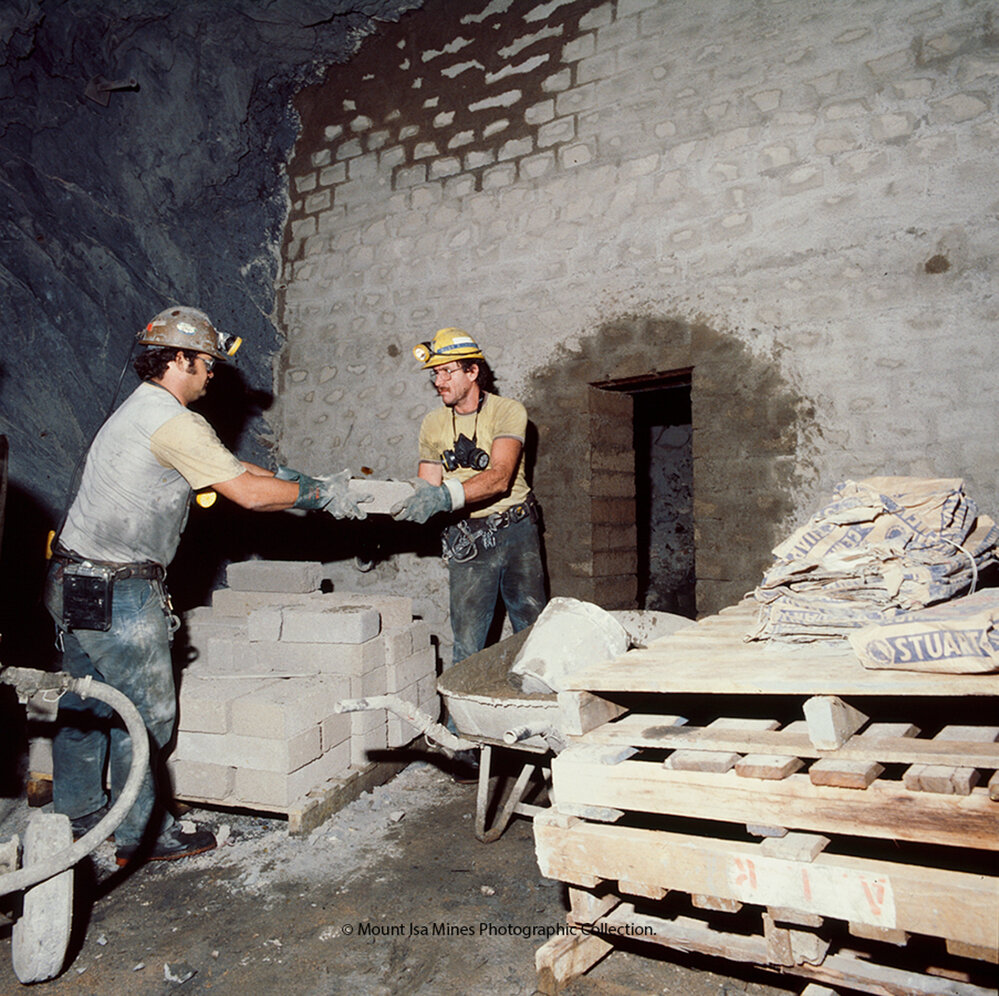 Underground workers building a bulkhead in lead mine, Mount Isa Mines, c.1986