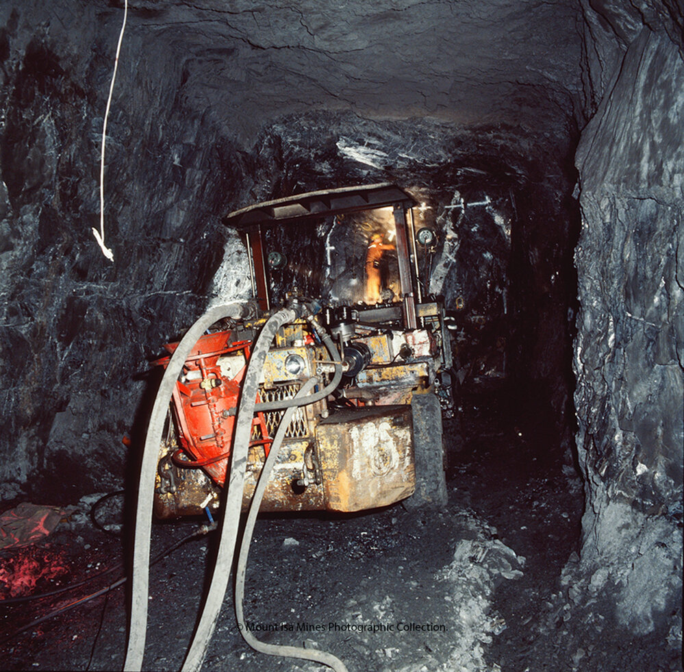 Charging a face with a Gardner Denver jumbo in lead mine, Mount Isa Mines, December 1989
