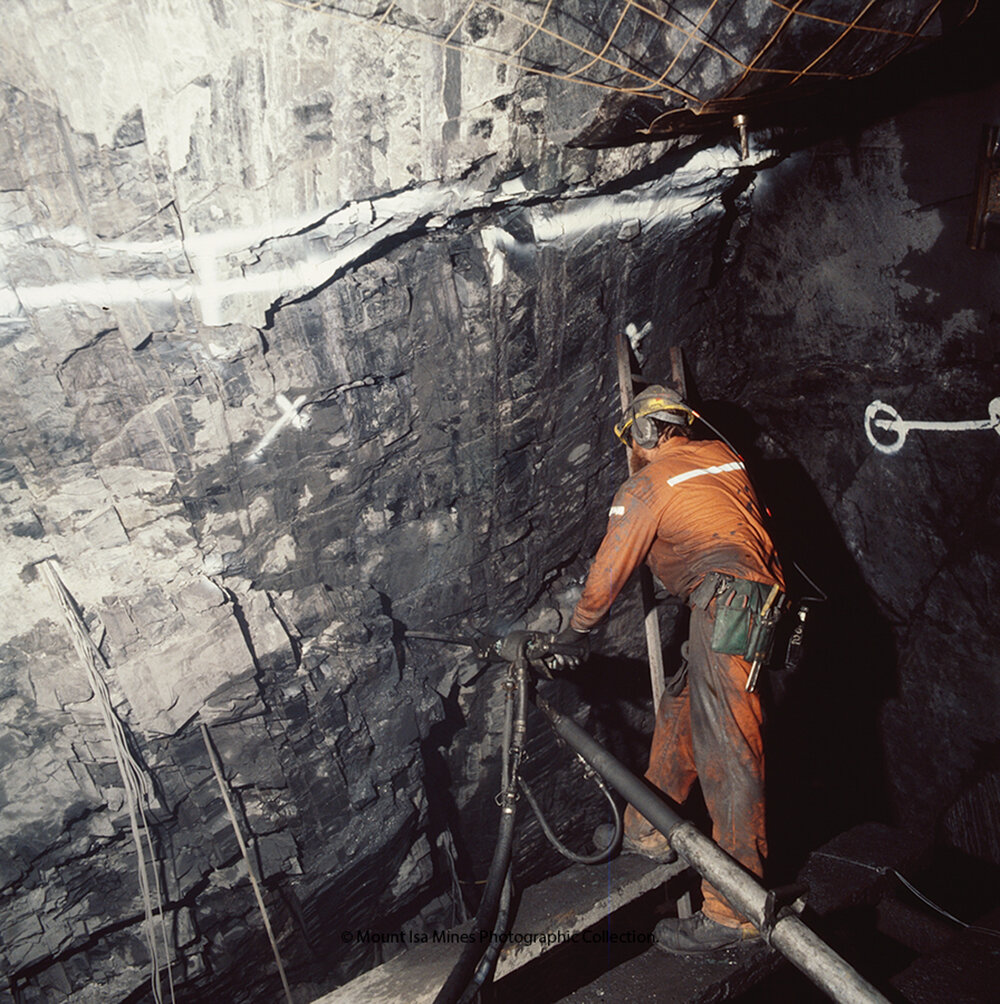 Flatbacker using an air leg drill in lead mine, Mount Isa Mines, December 1989