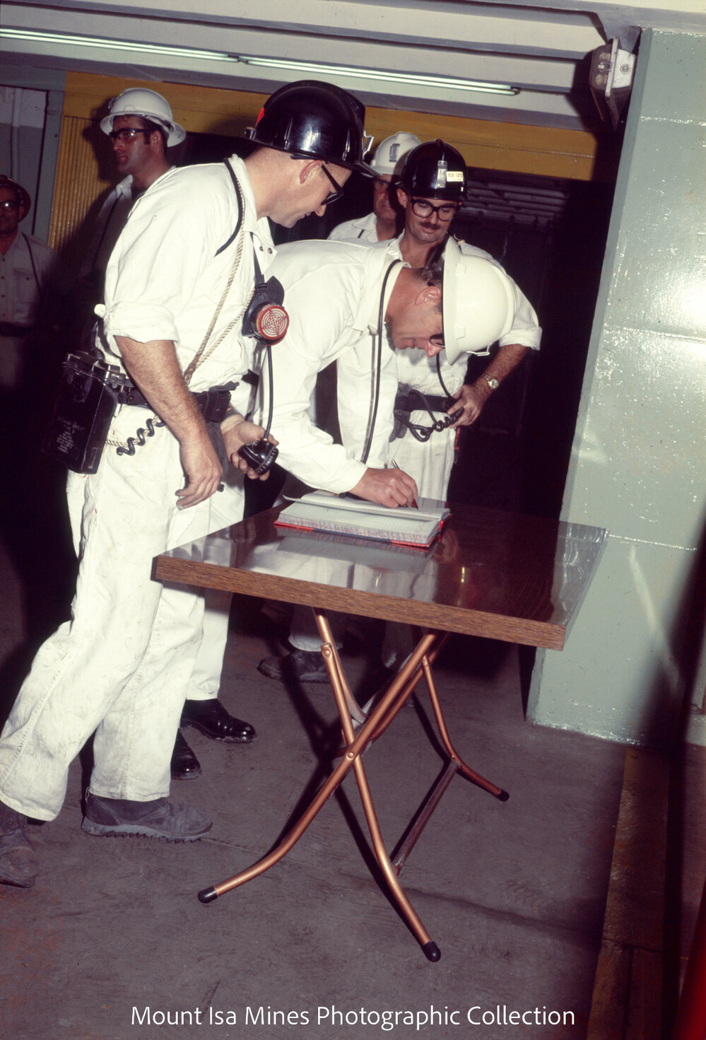 Prince Philip signs visitor log, Mount Isa Mines, April 1970