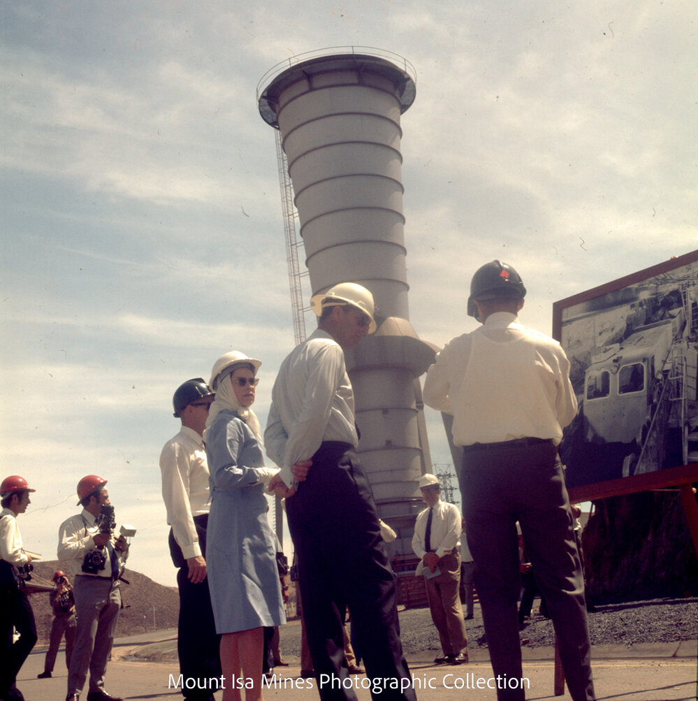 Queen Elizabeth II and Prince Philip view photograph of underground haulage operations, Mount Isa Mines, April 1970