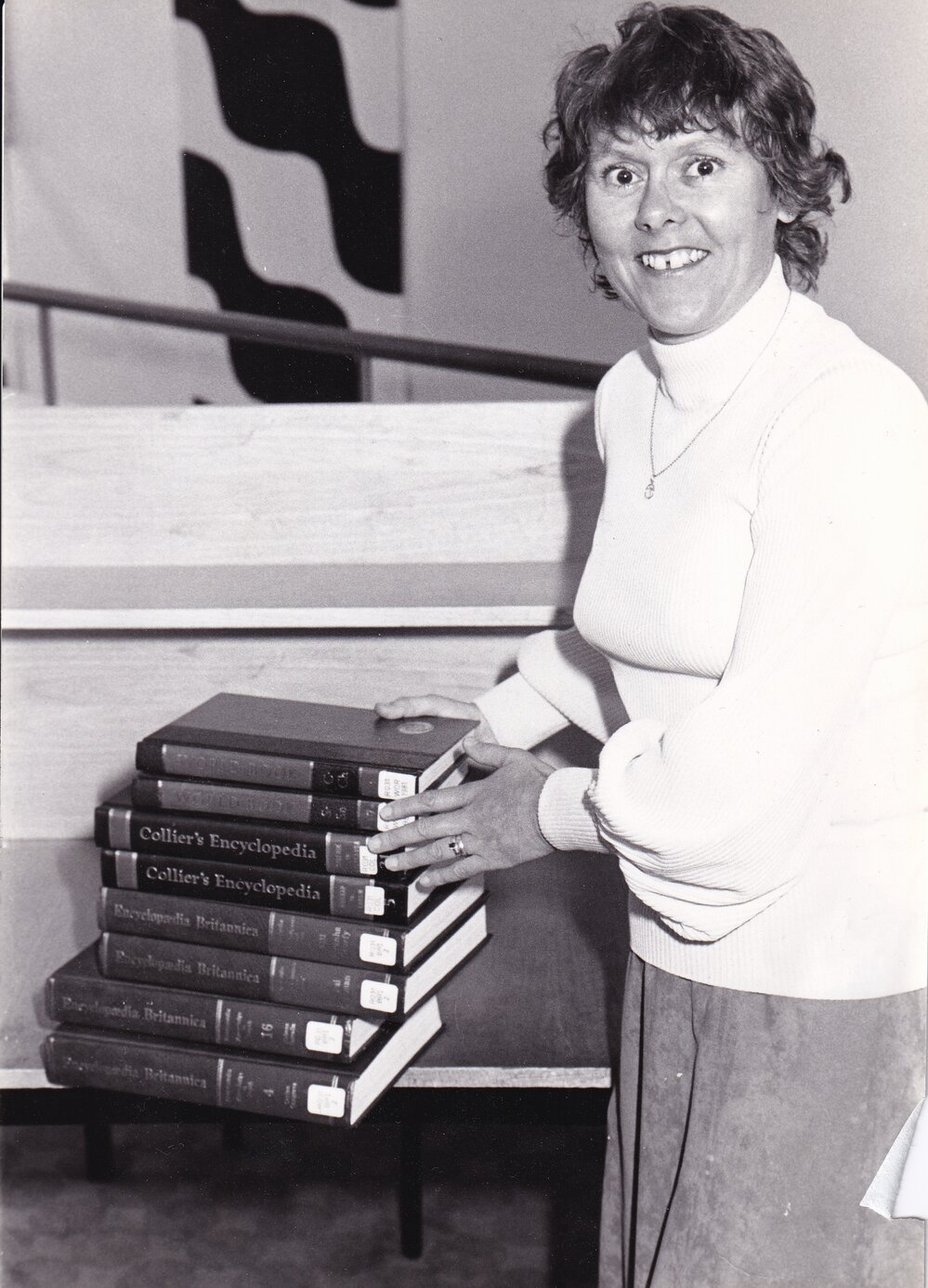 Trudy Zussino with library encyclopedias 