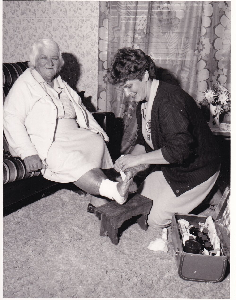 Blue Nursing Service Nurse providing assistance