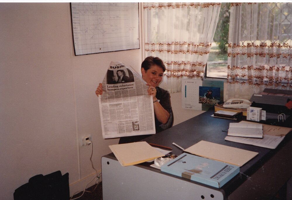 Woman holding newspaper