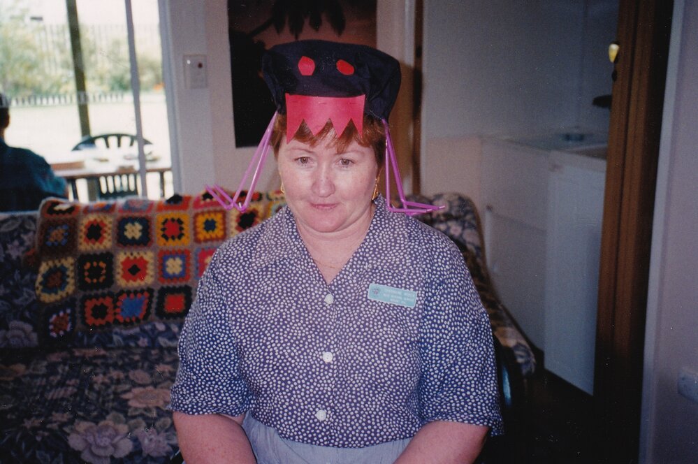 Blue Nursing Service nurse wearing crazy hat