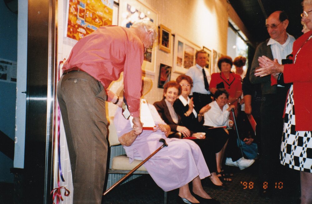 Presenting awards at 75th celebration art event, c.1998