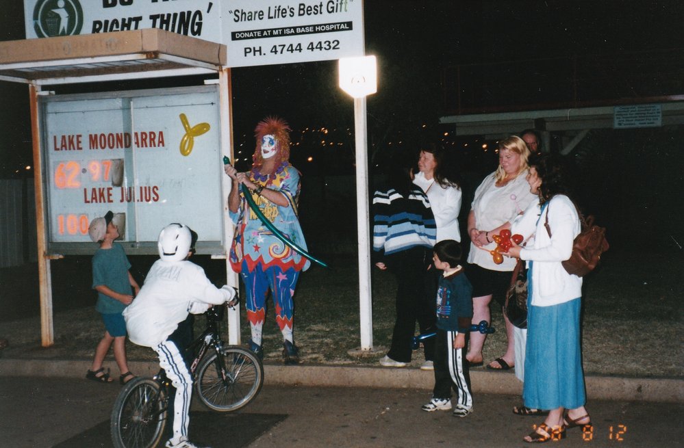 Balloon animal clown with children, August 1998