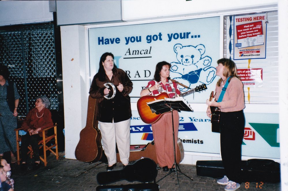 Buskers outside Amcal Chemist, Mount Isa City, August 1998