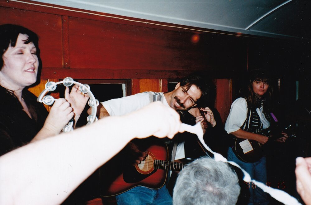 Musicians on train performing, c.1998
