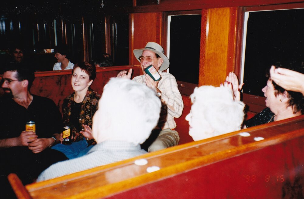 Passengers on train listening to performance, c.1998
