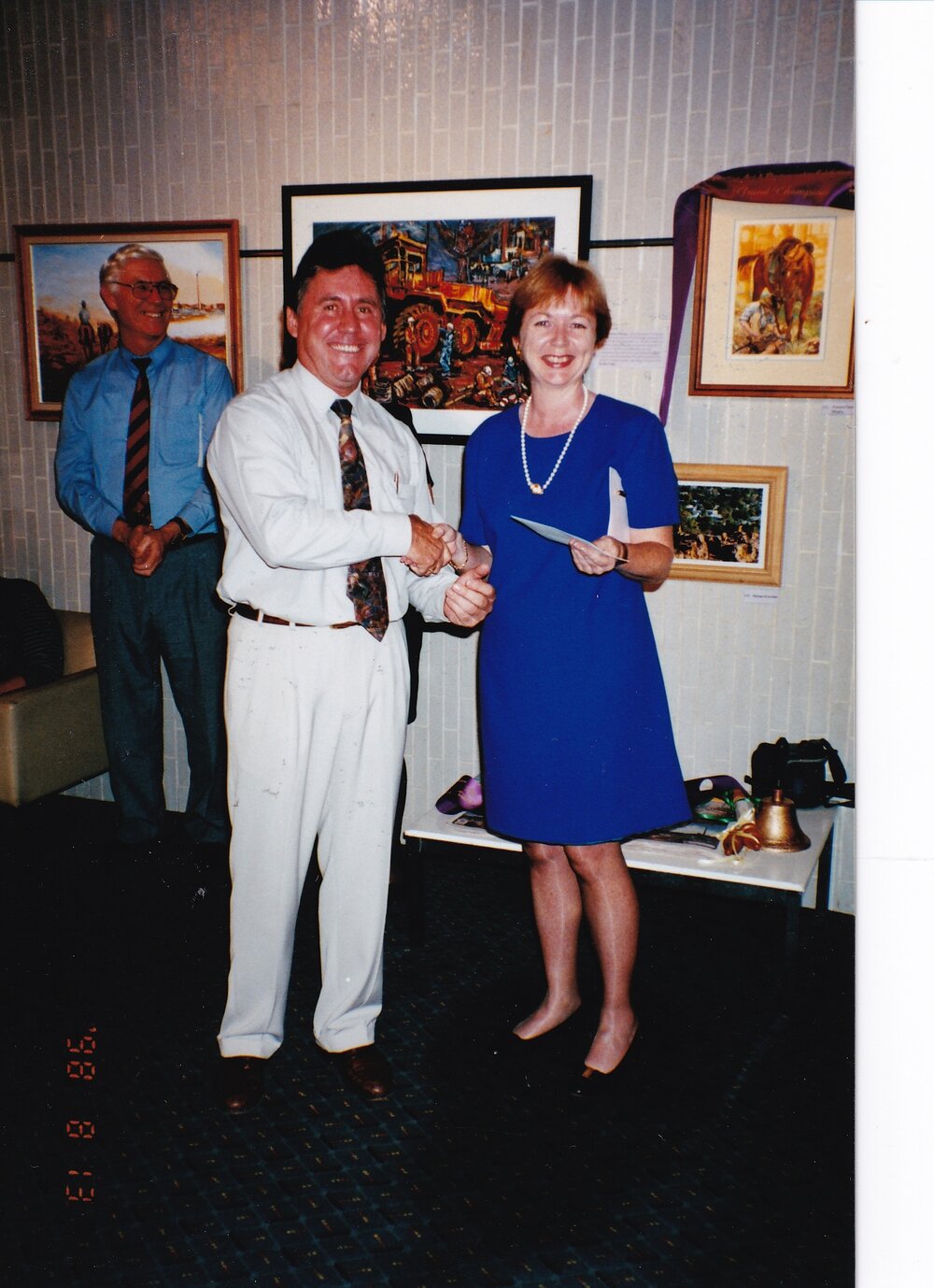 Recipient of award at Civic Centre artwork event, c.1998