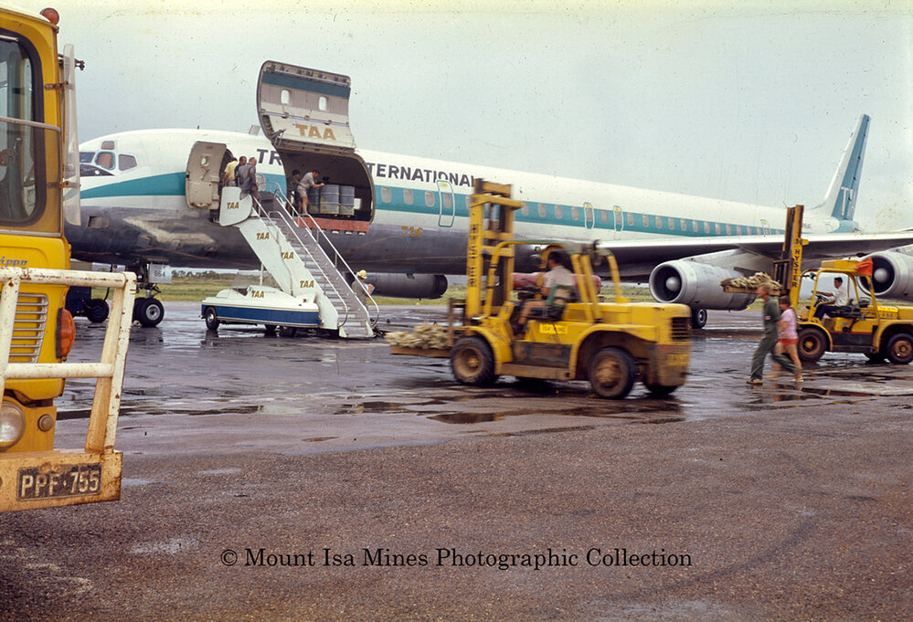 DC8 at Mount Isa airport unloading supplies during flood, June 1975